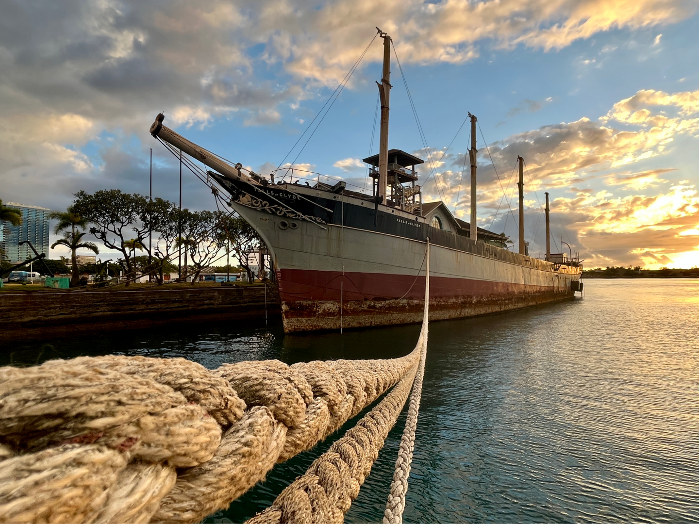 View of Oil Ship Falls of Clyde in Honolulu harbor at sunset